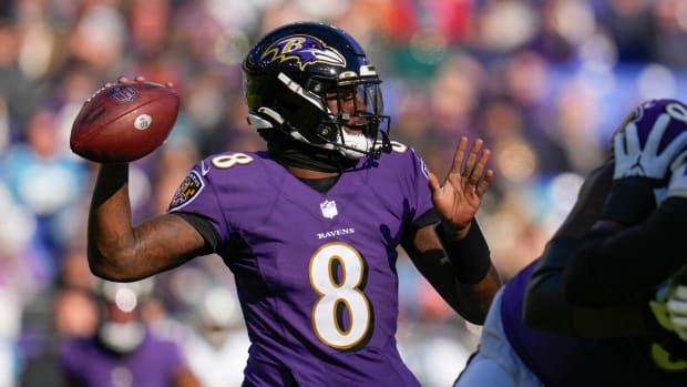 Nov 20, 2022; Baltimore, Maryland, USA; Baltimore Ravens quarterback Lamar Jackson (8) throws against the Carolina Panthers during the first half at M&T Bank Stadium. Mandatory Credit: Jessica Rapfogel-USA TODAY Sports